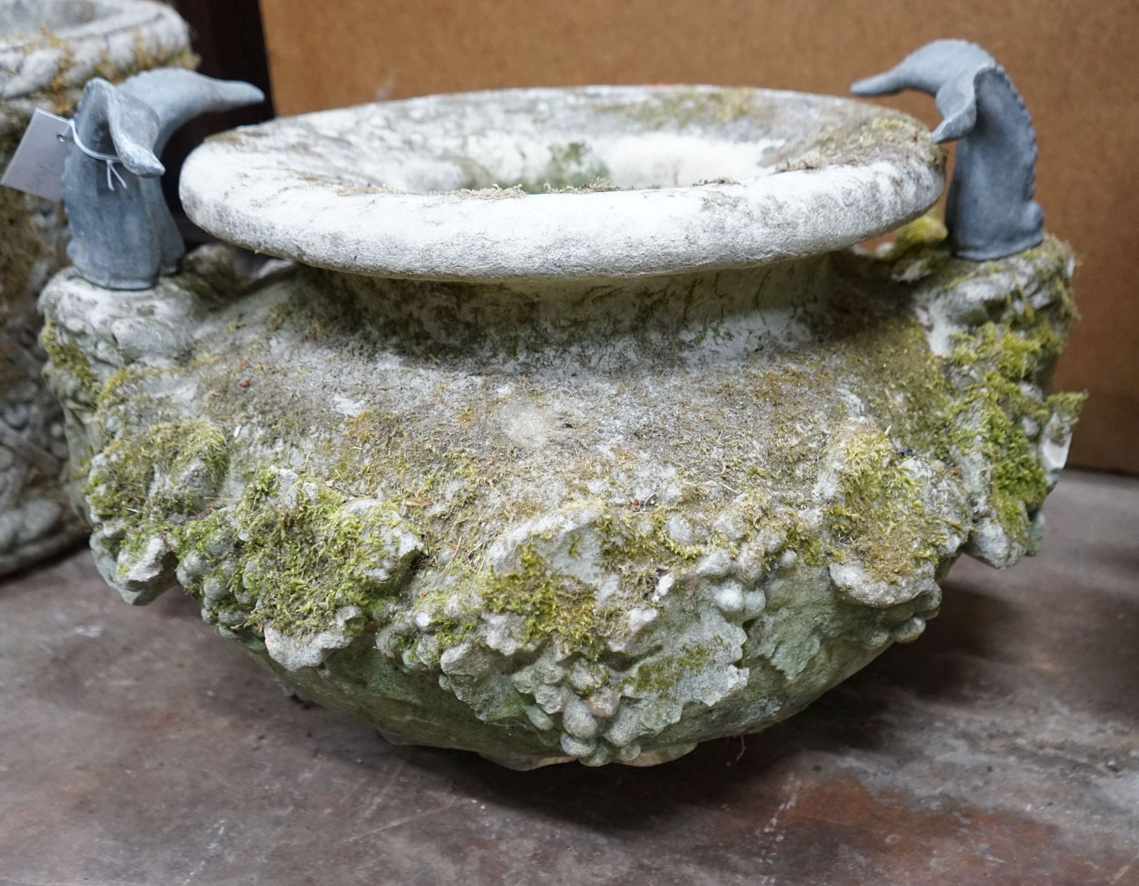 A large circular reconstituted stone ram's head garden planter / fountain head, diameter 66cm, height 42cm